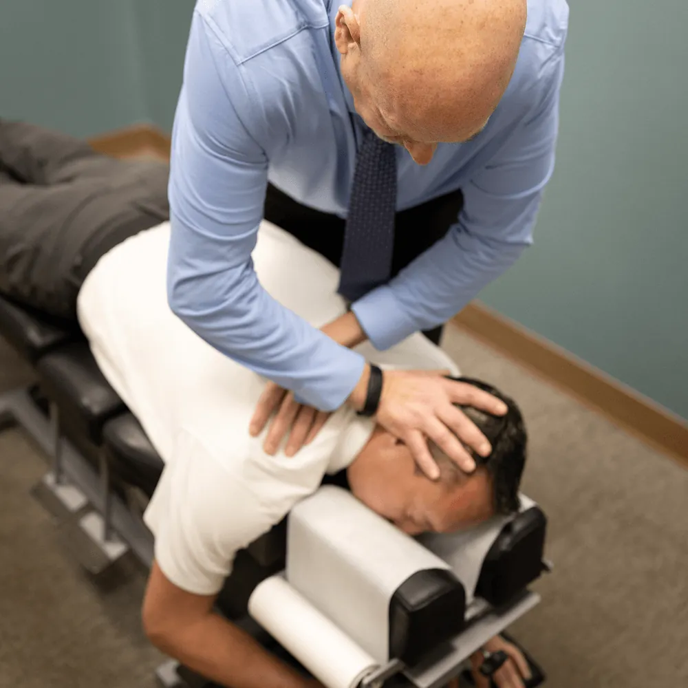 Dr. Ed performing a cervical adjustment