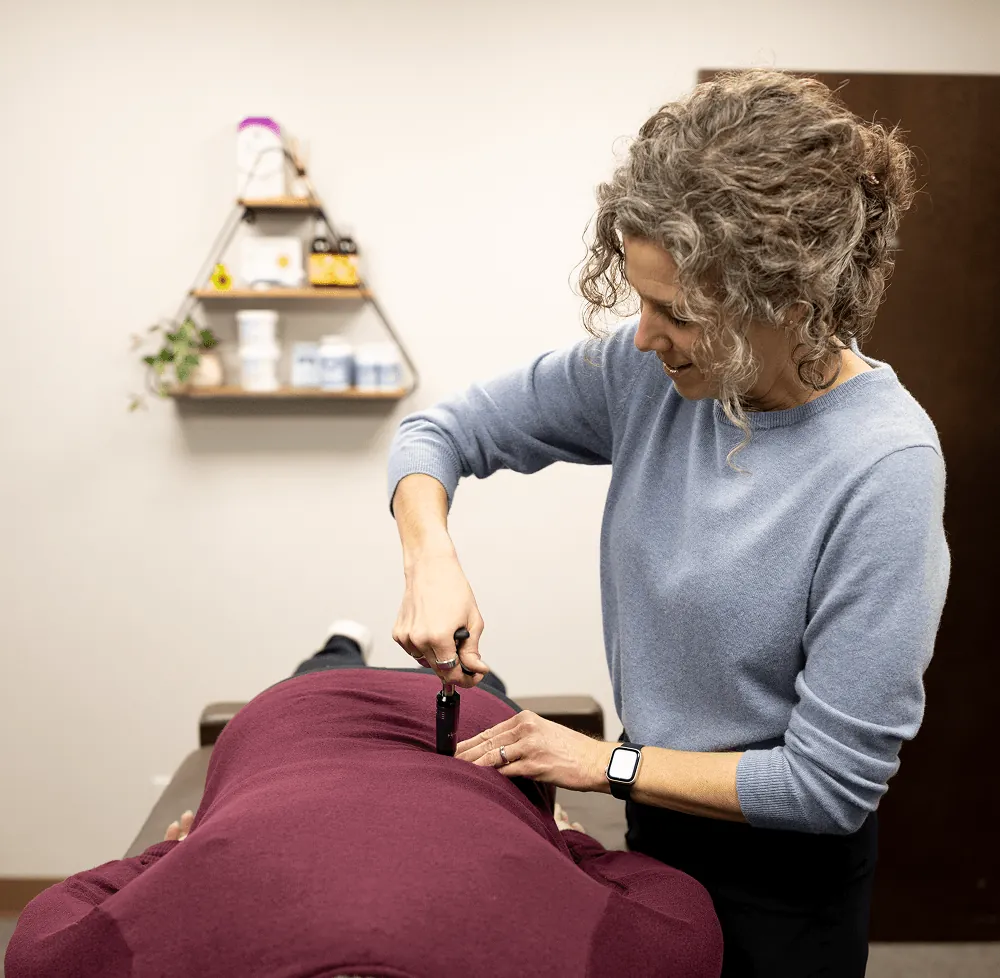 Dr. Stacy adjusting a patient's pelvis