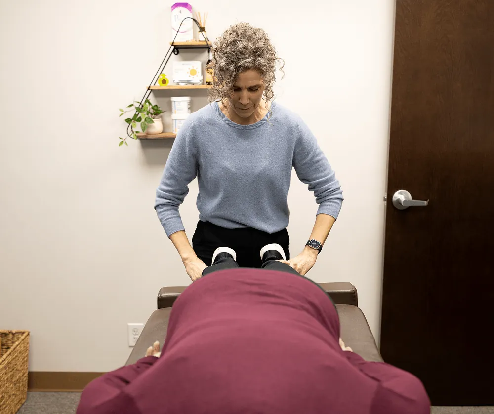 Dr. Stacy assessing pelvic alignment