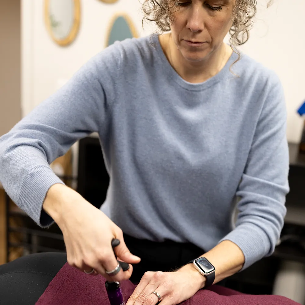 Dr. Stacy adjusting a patient's wrist