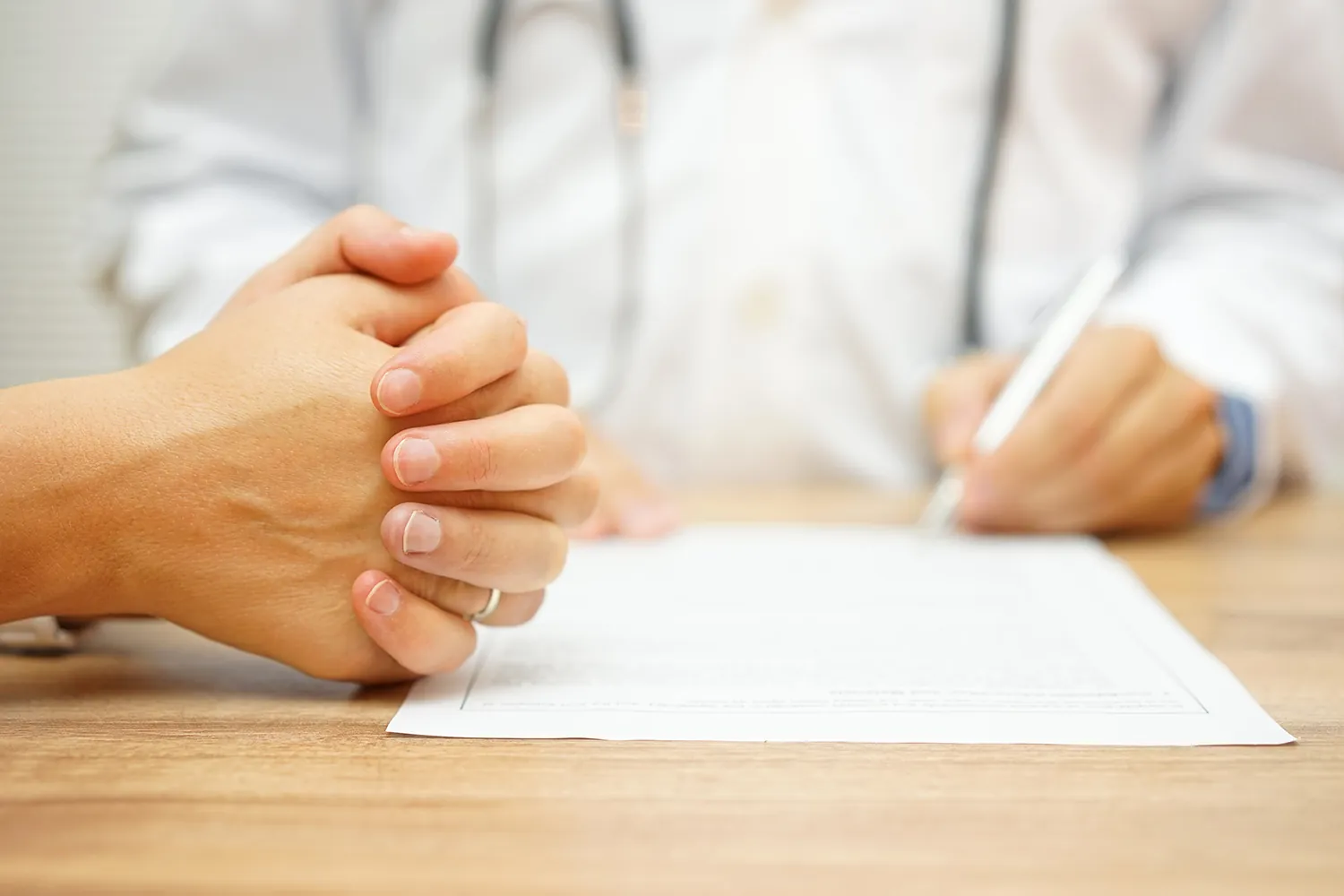 Chiropractor reviewing a report of findings with a patient